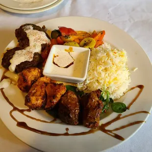 Caravan Kebab Special with lamb, chicken and Turkish Kofta Kebabs. The rice is awesome and the side veggies were absolutely amazing!