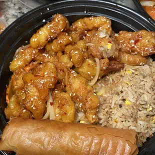 Sesame chicken with fried rice and eggroll (combo)! IG: @bettyeatsthecity