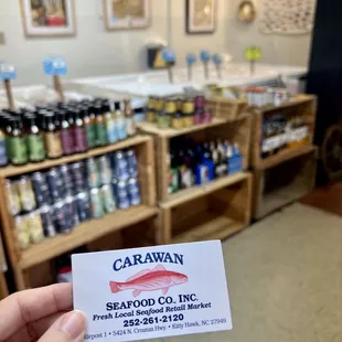 a person holding up a business card