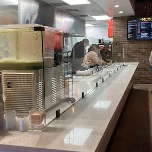 Order at the far end of that counter by the menu.