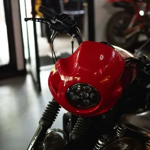 the front end of a red motorcycle