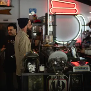 two men standing at the counter