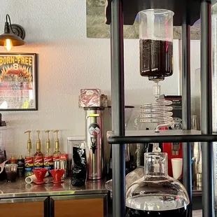 a coffee maker with a glass container