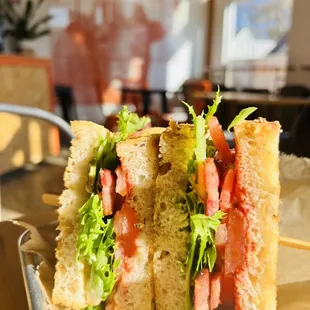 Thick Slab Bacon BLT (Bacon from Peterson Farms), with Revol Greens, Tomato Jam, on buttered toasted Multigrain Bread.