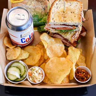 Boxed Lunch with chips, a Northern Soda, and cookie.