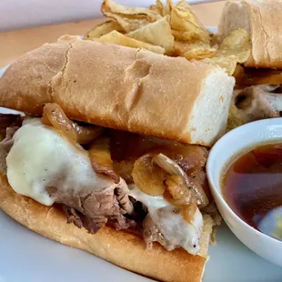 The Dipper with Pit Beef, "Whiz", caramelized onions and Au Jus.