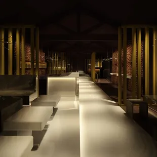 a row of sinks in a dimly lit room