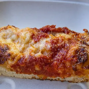 a slice of pizza on a plate