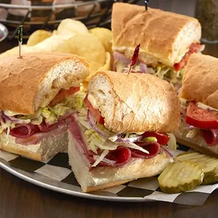 a plate of sandwiches and chips