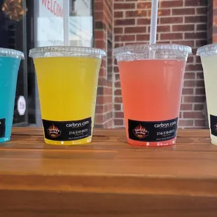 three drinks on a wooden table