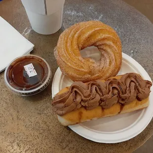 Churro donut with chocolate ganache and cherry almond fudge donut