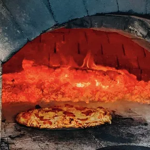 A perfect summer night: pizza from the oven, golden hour, and the view of the mountain peak!