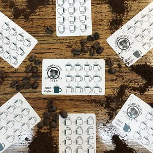 a variety of coffee cards on a table