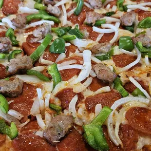 Cardo&apos;s Special Sausage, pepperoni, sausage, onions, green peppers, (minus the) mushrooms.