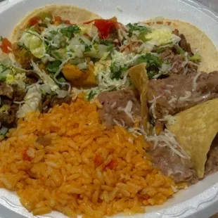 Plate with a taco each of pollo, asada, y carnitas. 5$ or so, if memory serves correct. Trucks charge different, so YMMV.