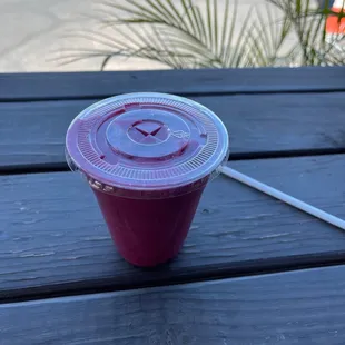 a plastic cup on a picnic table