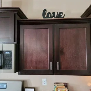 After damaged doors were replaced. Carefree refuses to match the color of the rest of the cabinets.