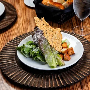 a plate of food and a glass of wine