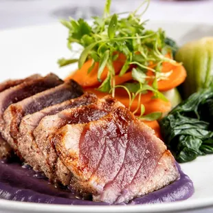 a plate of meat and vegetables