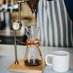 a person pouring coffee