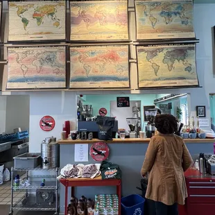 a woman standing in front of a counter