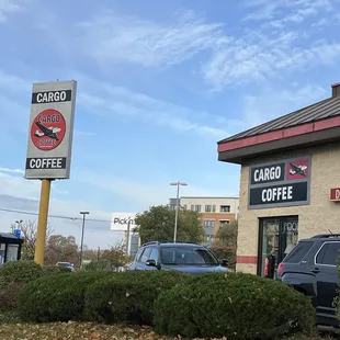 a car parked in front of a coffee shop