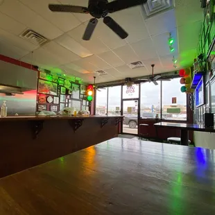 a view of a bar with a ceiling fan