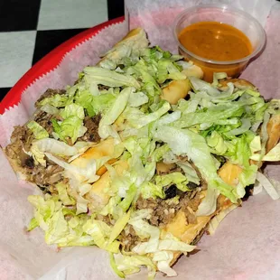 Z-28 Cheesesteak w/ side of Turbo Sauce.  Lots of steak &amp; cheese under that lettuce!
