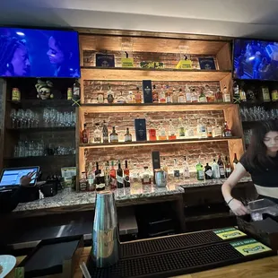 a woman behind the bar