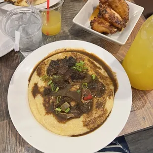 Grits and oxtail and wings