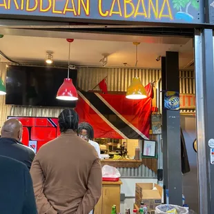 people standing in front of a restaurant