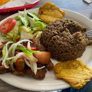 Fried Goat, Plantains, (Brown) Rice and Beans, and salad.