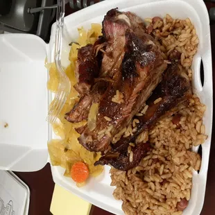 Pork ribs with rice &amp; bean and cabbage.