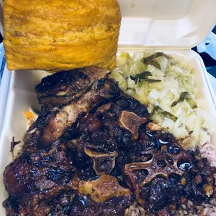 Oxtails / jerk chicken/ beef patty/  rice and beans / cabbage.