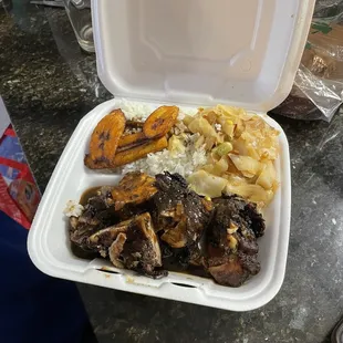 Jerk Chicken, Fried Plantains, rice, cabbage