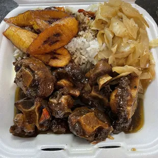 Ox Tails, Fried Plantains, rice, cabbage