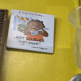 a plate with a picture of a man eating a banana