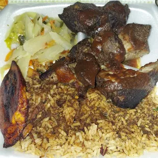Jerk pork, rice n peas, cabbage, one plantain