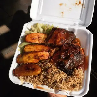Jerk chicken, rice, cabbage, plantains.