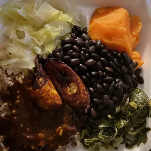 Veggie Plate Cabbage  Rice and Peas with brown stew  Sweet Yams Black Beans Collard Greens