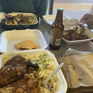 Curry chicken plate, oxtail plate, and jerk chicken