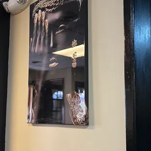 a picture of a woman&apos;s face on the wall