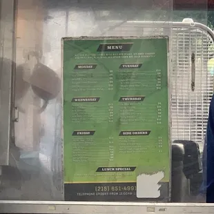 a menu on a food truck