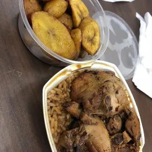 Lunch sampler: jerk chicken over beans and rice with oxtail sauce with a side of plantains