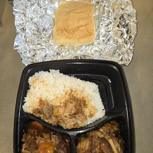 Brown stew chicken with rice and coco bread
