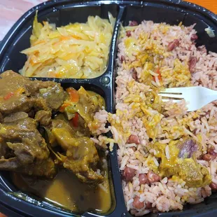 Goat curry with red beans and rice. Never had cauliflower as it's own side before and this place showed me I've been wrong for 39 years