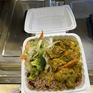 Curried Chicken, Steamed cabbage and Rice and Beans