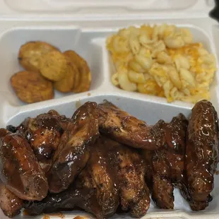 Wings with a side of Mac and cheese and plantains.