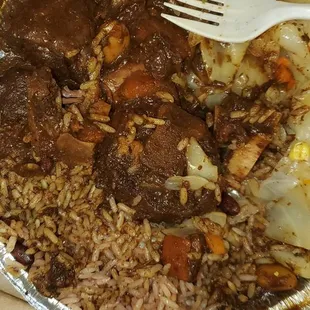 a plate of food with rice and meat