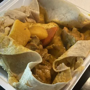 curry chicken in roti to go, it was aright